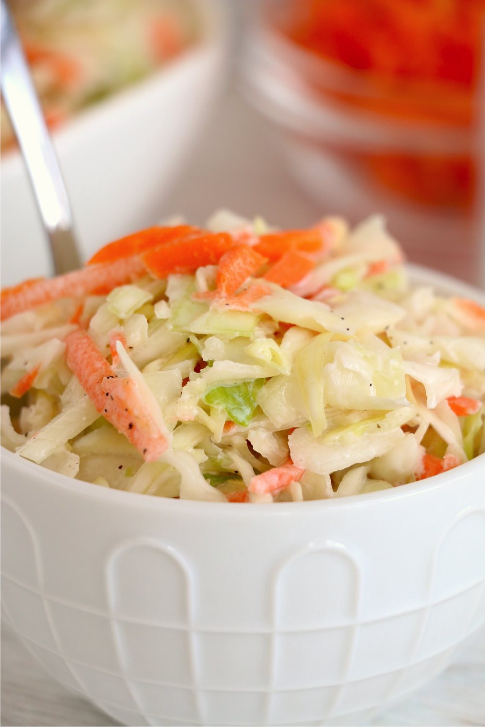up close shot of coleslaw in small white bowl