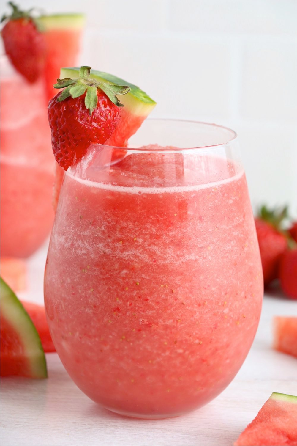 up close shot of frose wine with fruit garnish