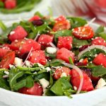 bowl of greens, watermelon, onions and feta cheese