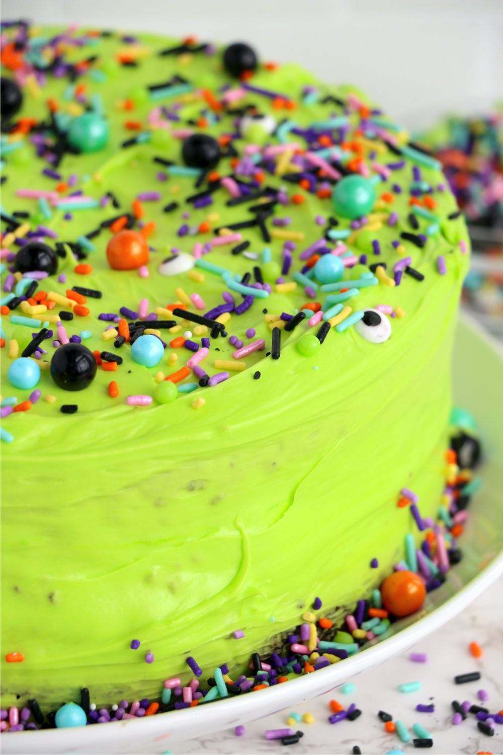 Neon green halloween cake with sprinkles
