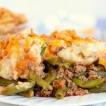 white plate with meat and potato casserole