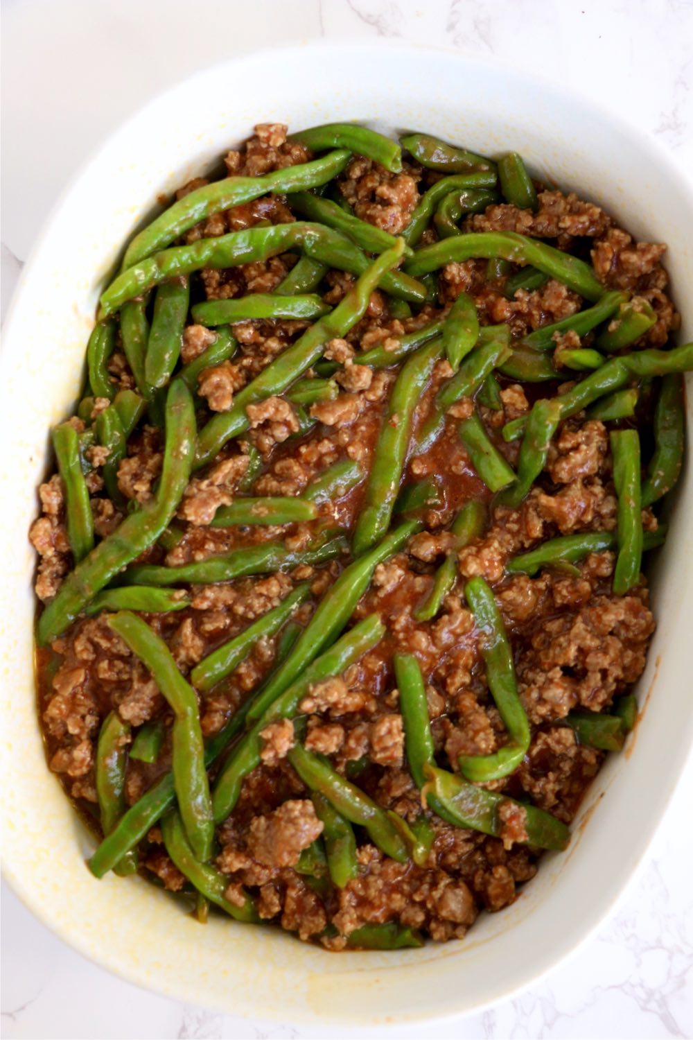 green beans and ground beef in casserole dish