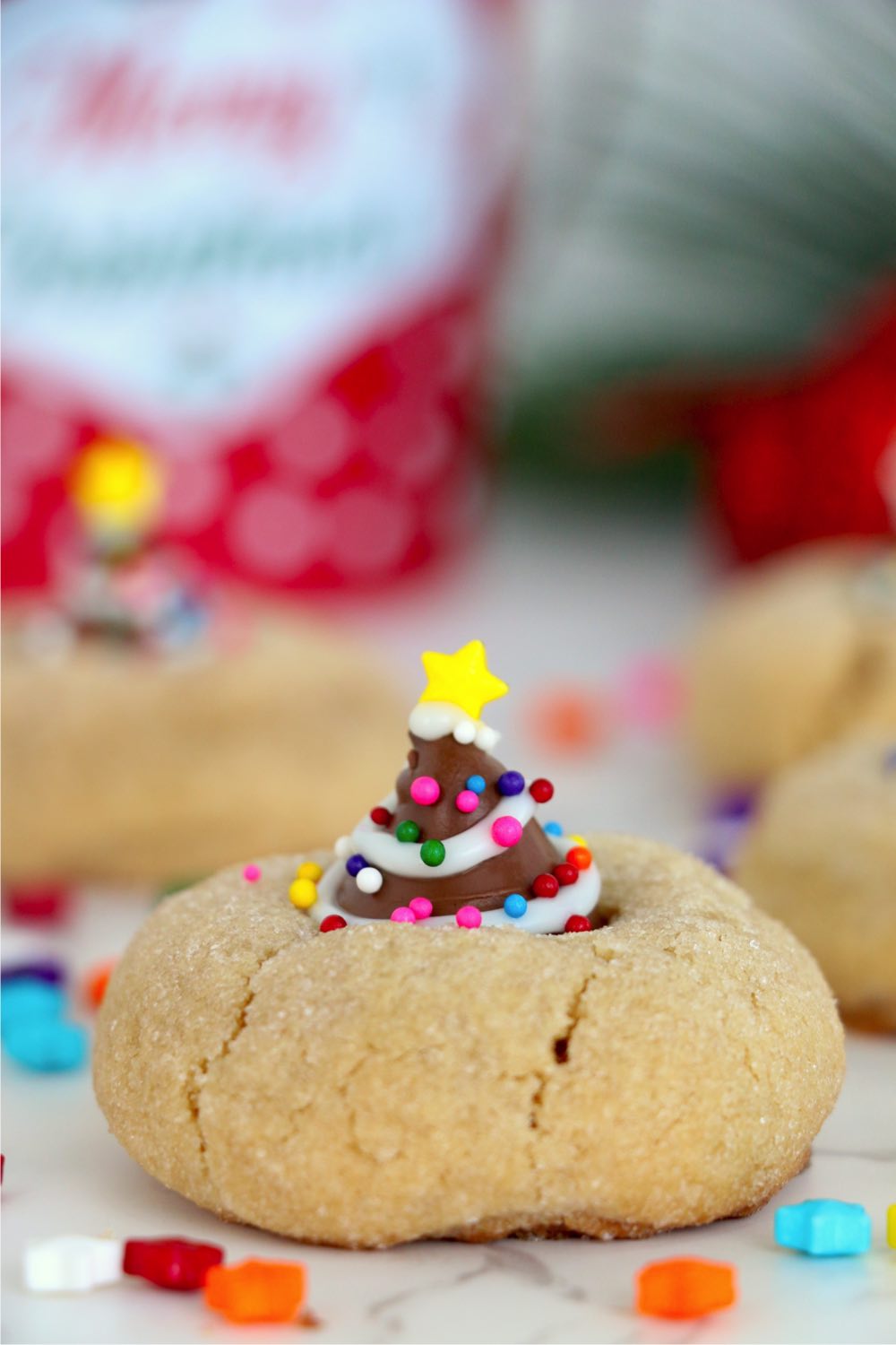 Christmas tree-decorated peanut butter blossoms