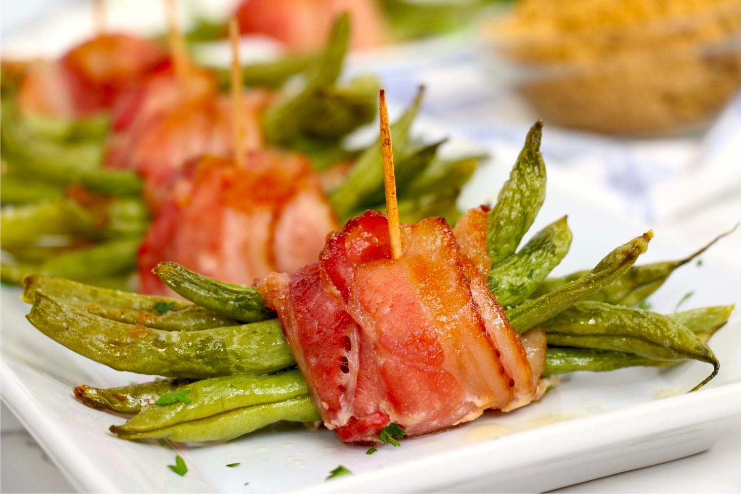 close up of bacon wrapped green bean bundles