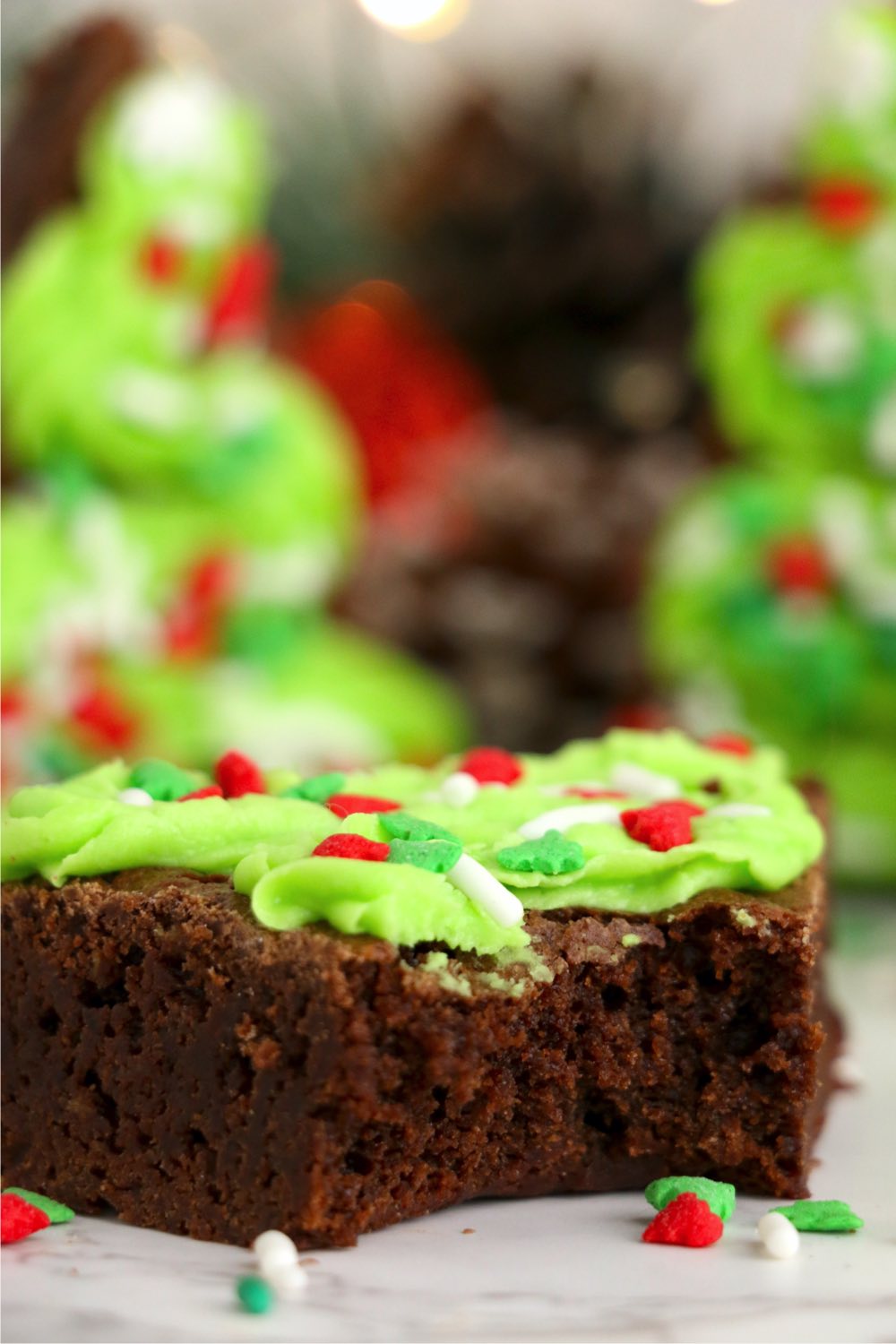 bite out of brownie decorated with green frosting