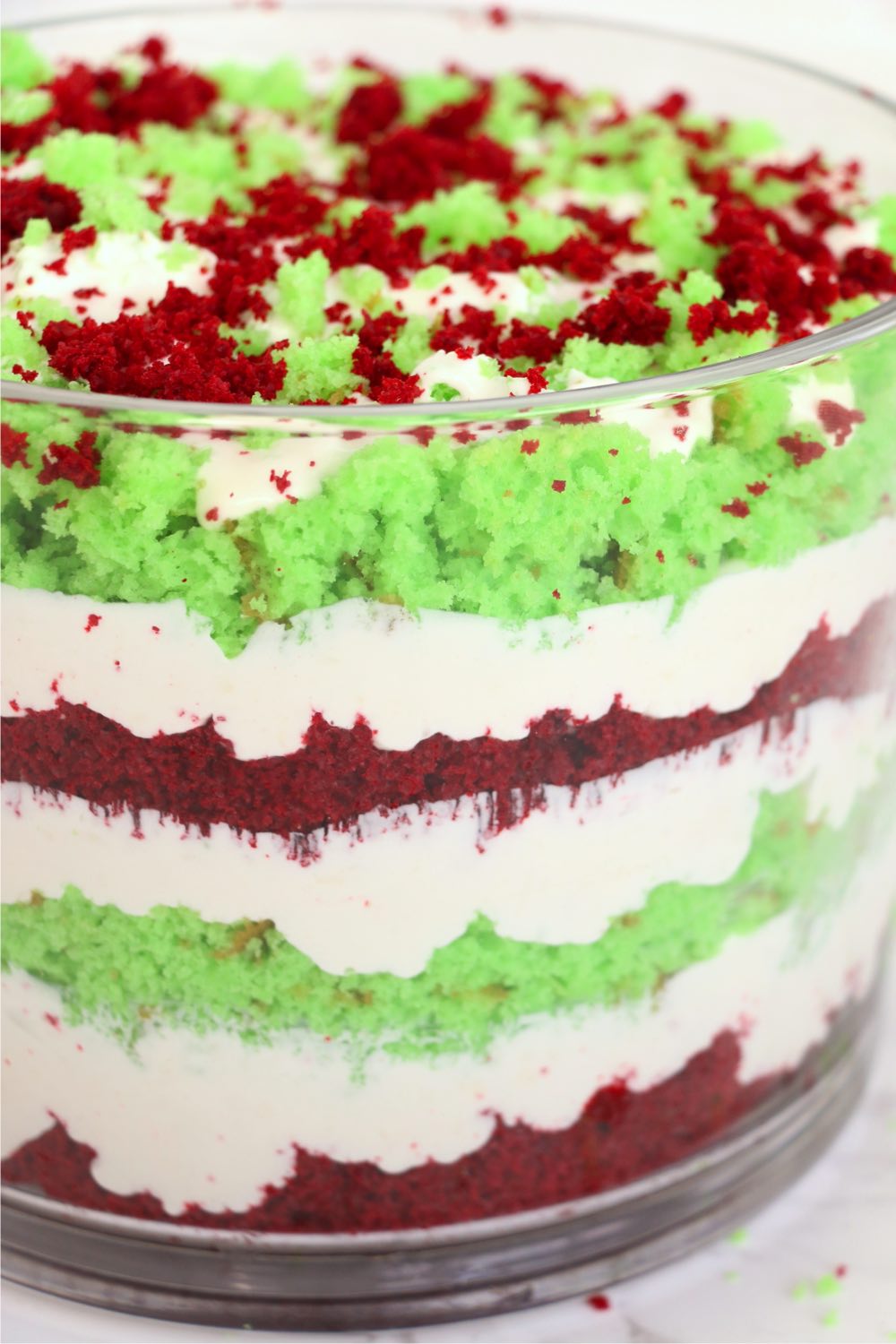 layers of holiday cake and cream in a trifle bowl