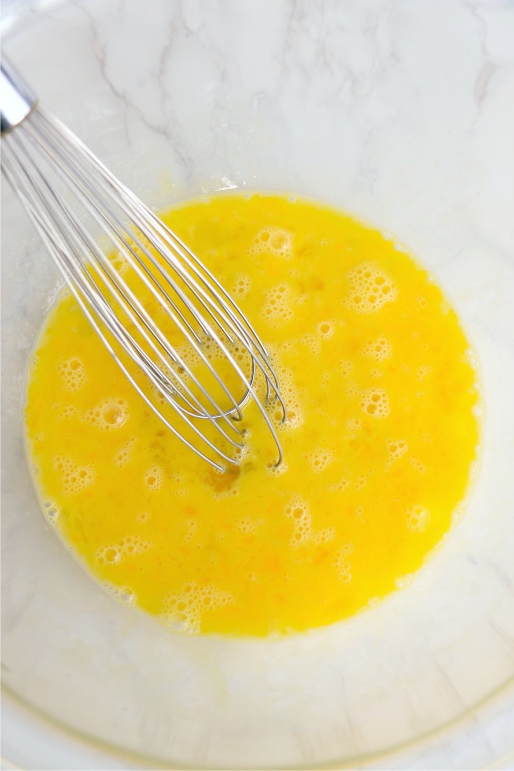 whisking eggs in bowl