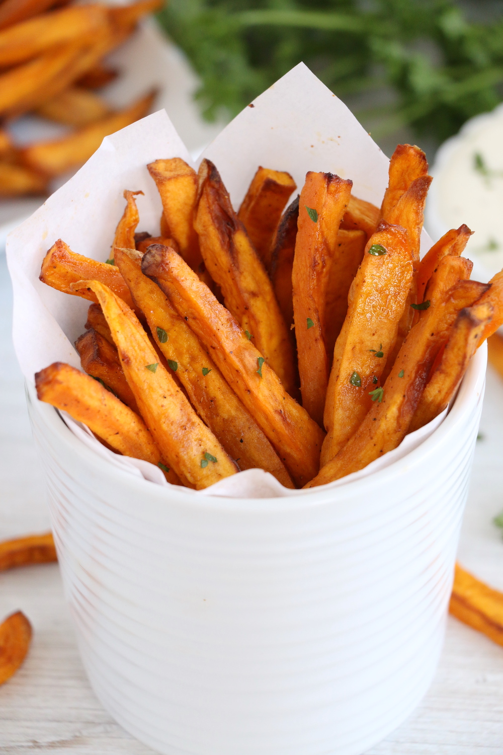 up close shot of sweet potato fries in cup