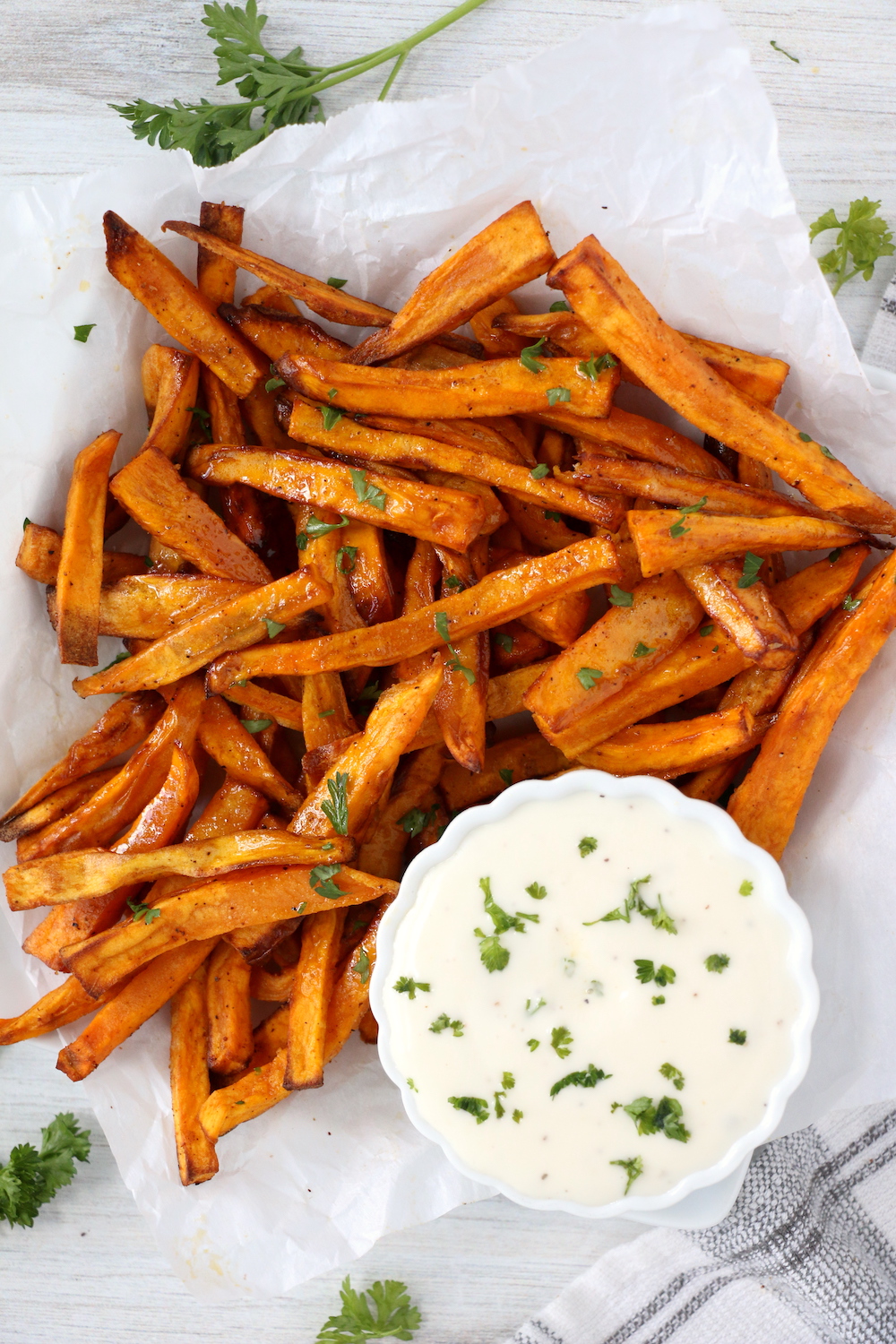 plate of sweet potato fries with ranch dipping cup