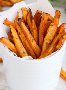 white cup with sweet potato fries