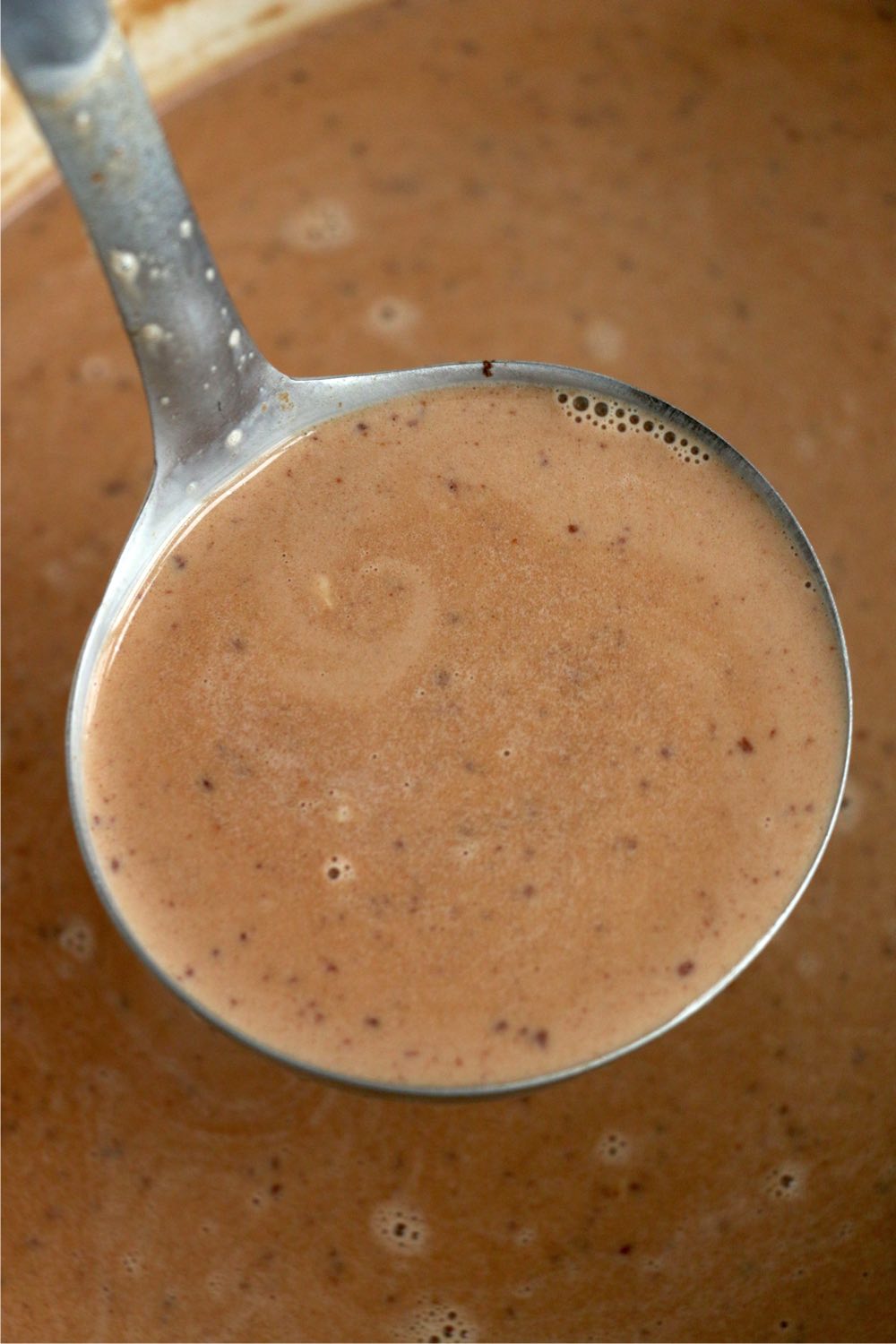 ladle filled with hot chocolate from the crockpot