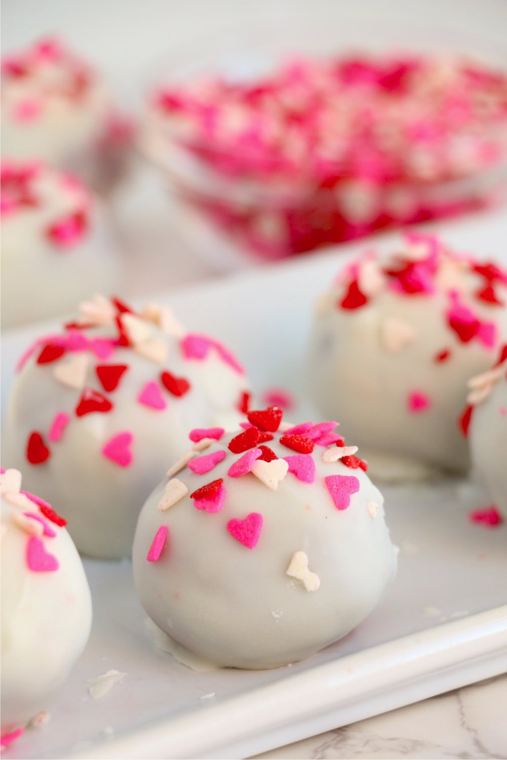 Valentine's cake balls on a white plate