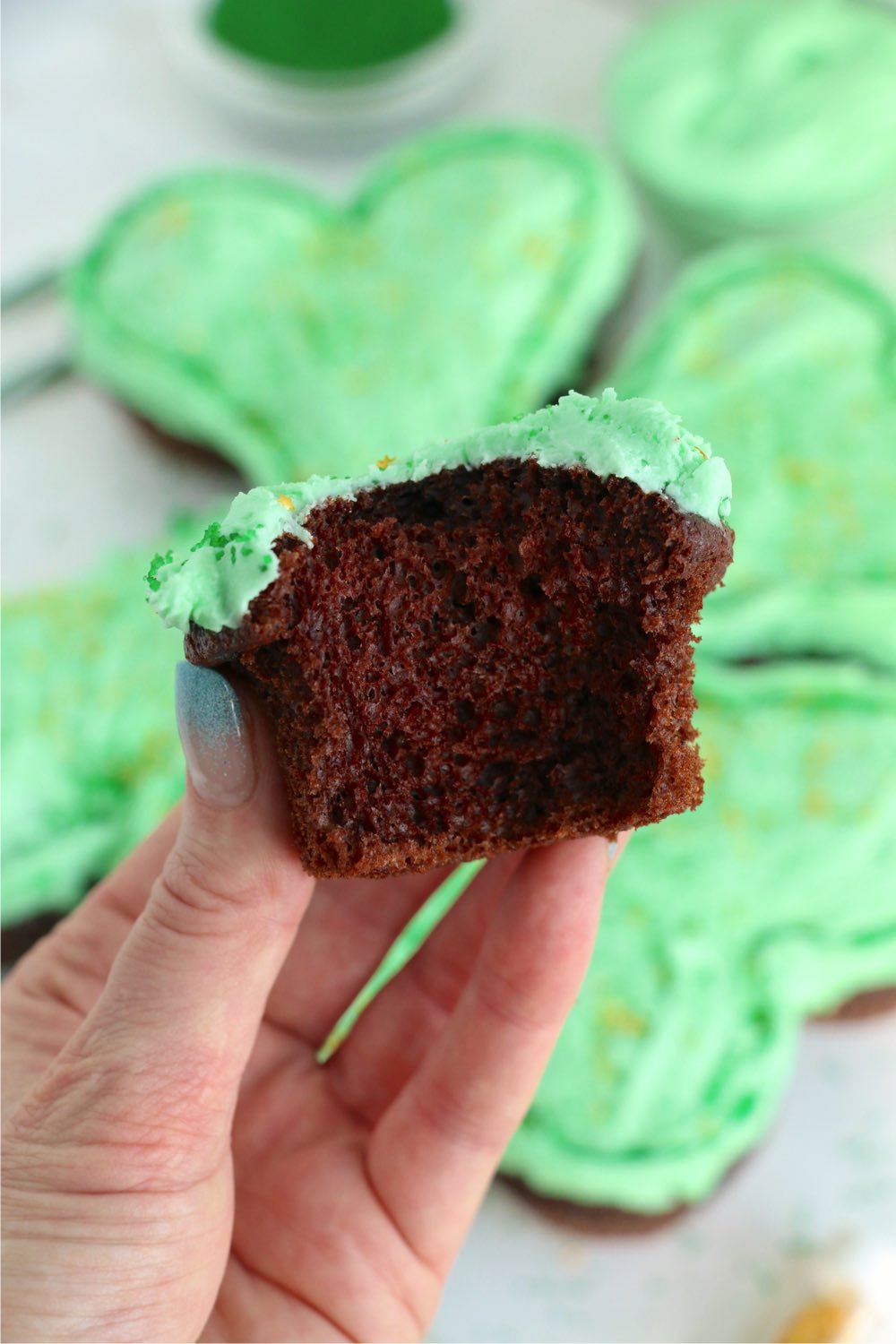 bite out of a chocolate cupcake for St. Patrick's Day
