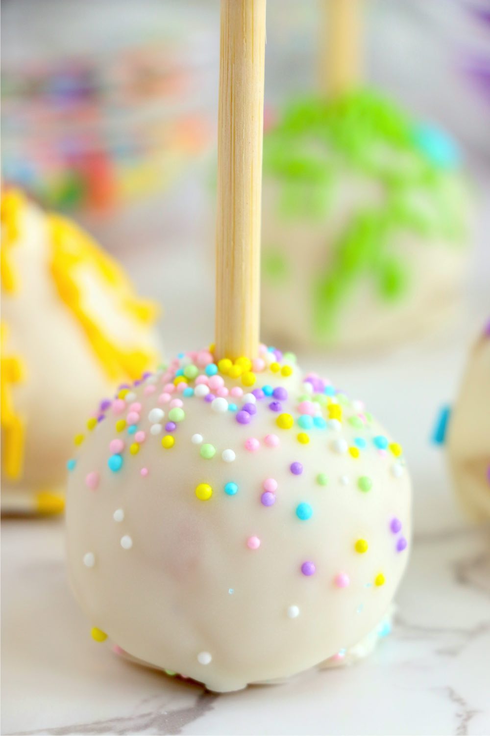 vanilla cake pop with pastel sprinkles