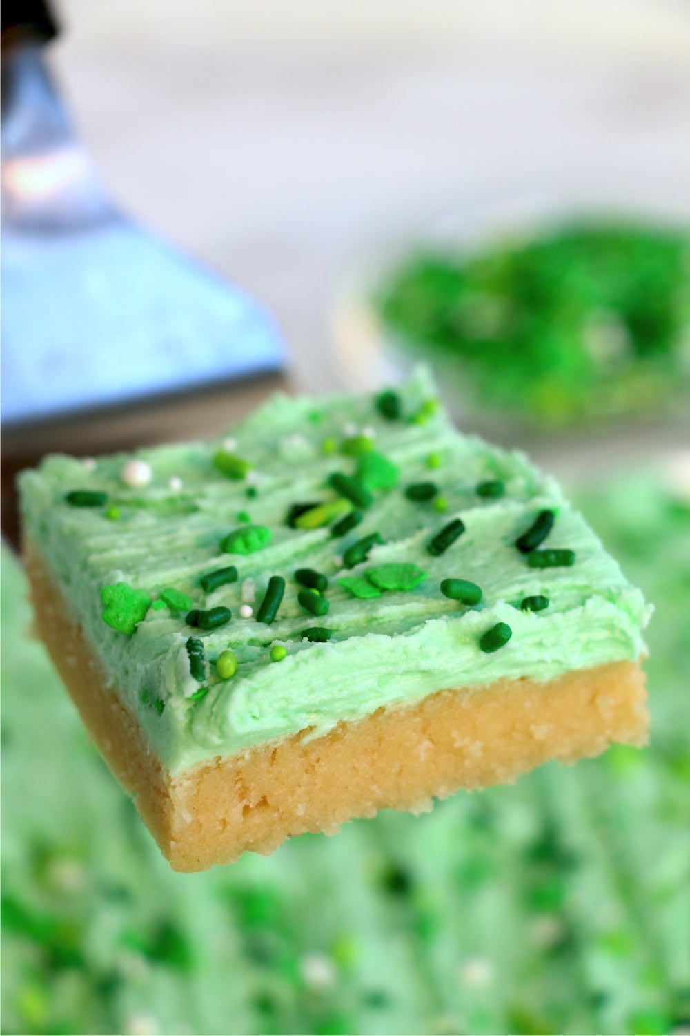 St. Patrick's Day sugar cookie cake bar on serving spoon