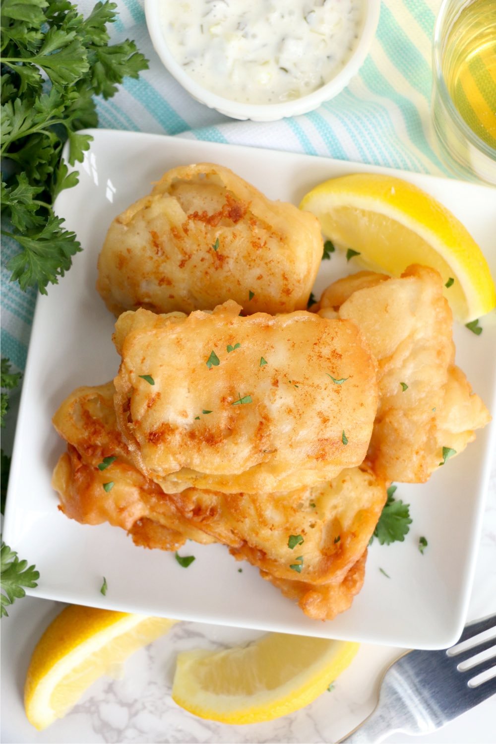 deep fried fish stacked on plate