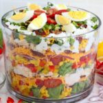 trifle bowl filled with a layer salad