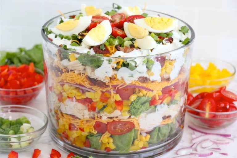 trifle bowl filled with a layer salad