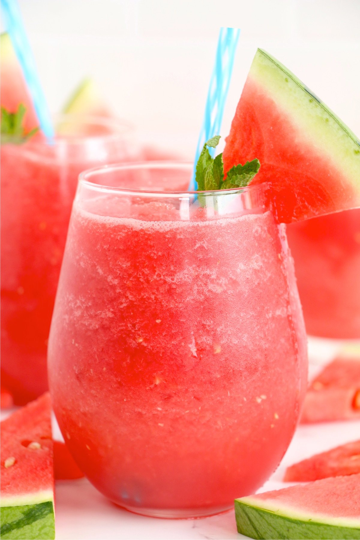 glass filled with red slushy drink