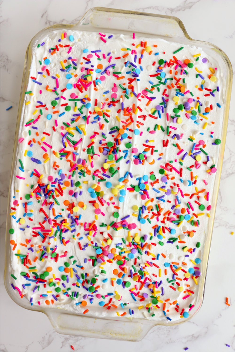 layer dessert garnished with rainbow sprinkles
