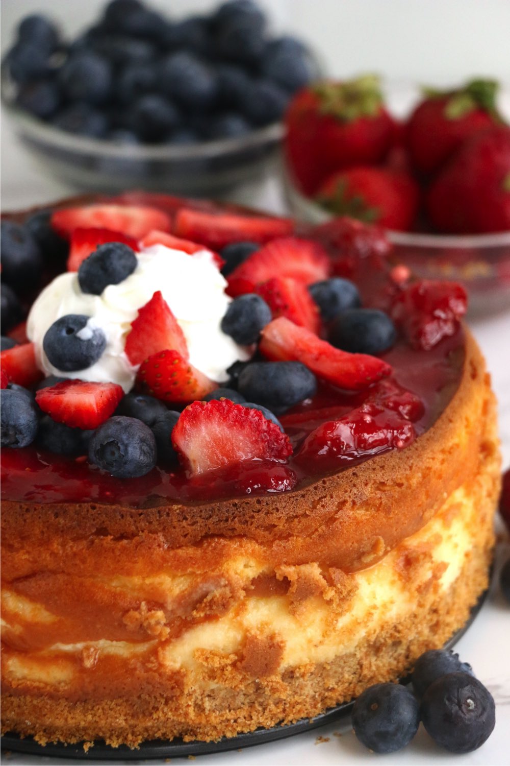 close up of cheesecake with fresh berry topping