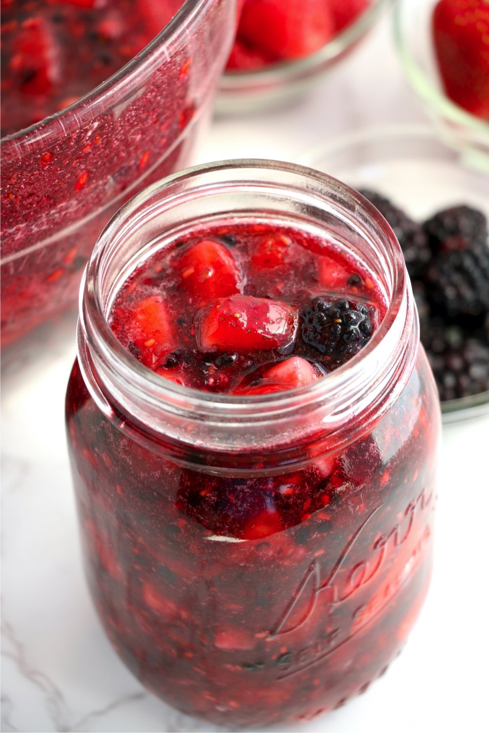 large glass mason jar of berry jam