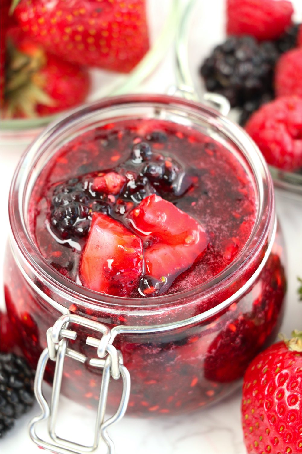 jelly jar filled with chunky mixed berry jam