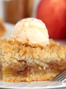 Apple Kuchen bar topped with scoop of ice cream