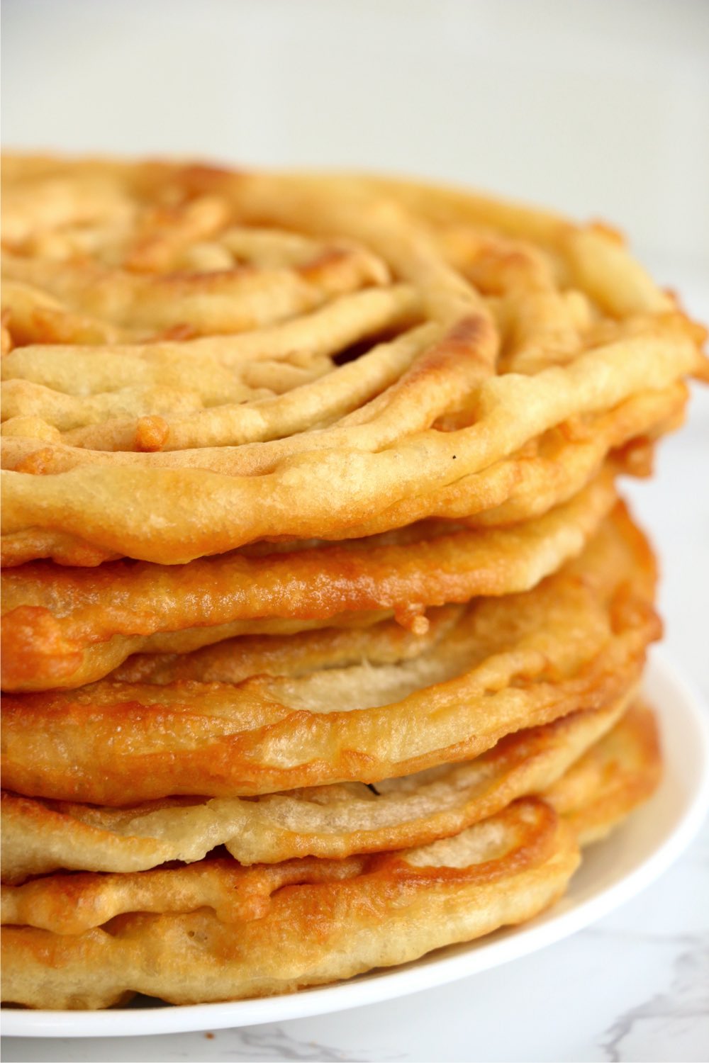 stack of fried funnel cakes