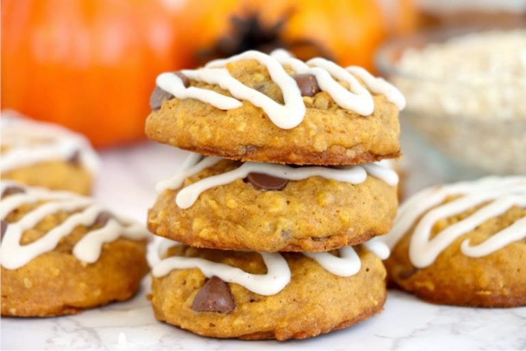 a stack of three pumpkin cookies