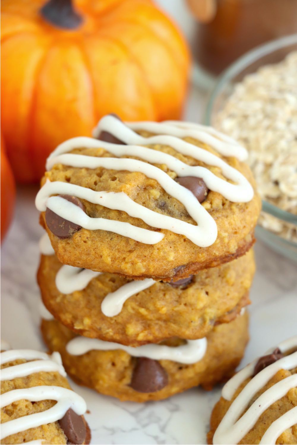 top view of pumpkin chocolate chip cookies with icing