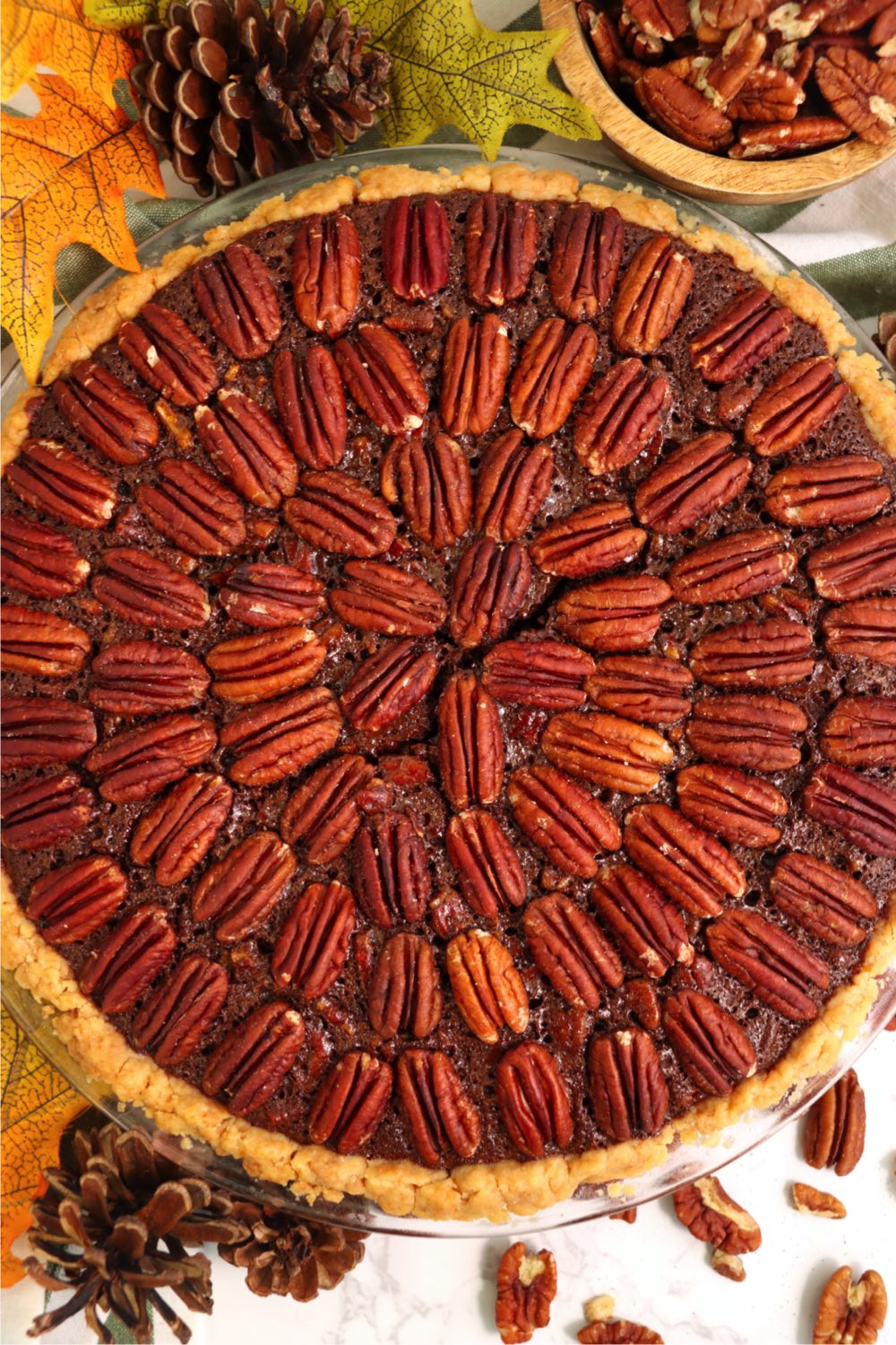 decorative arrangement of pecans on top of Kahlua pie