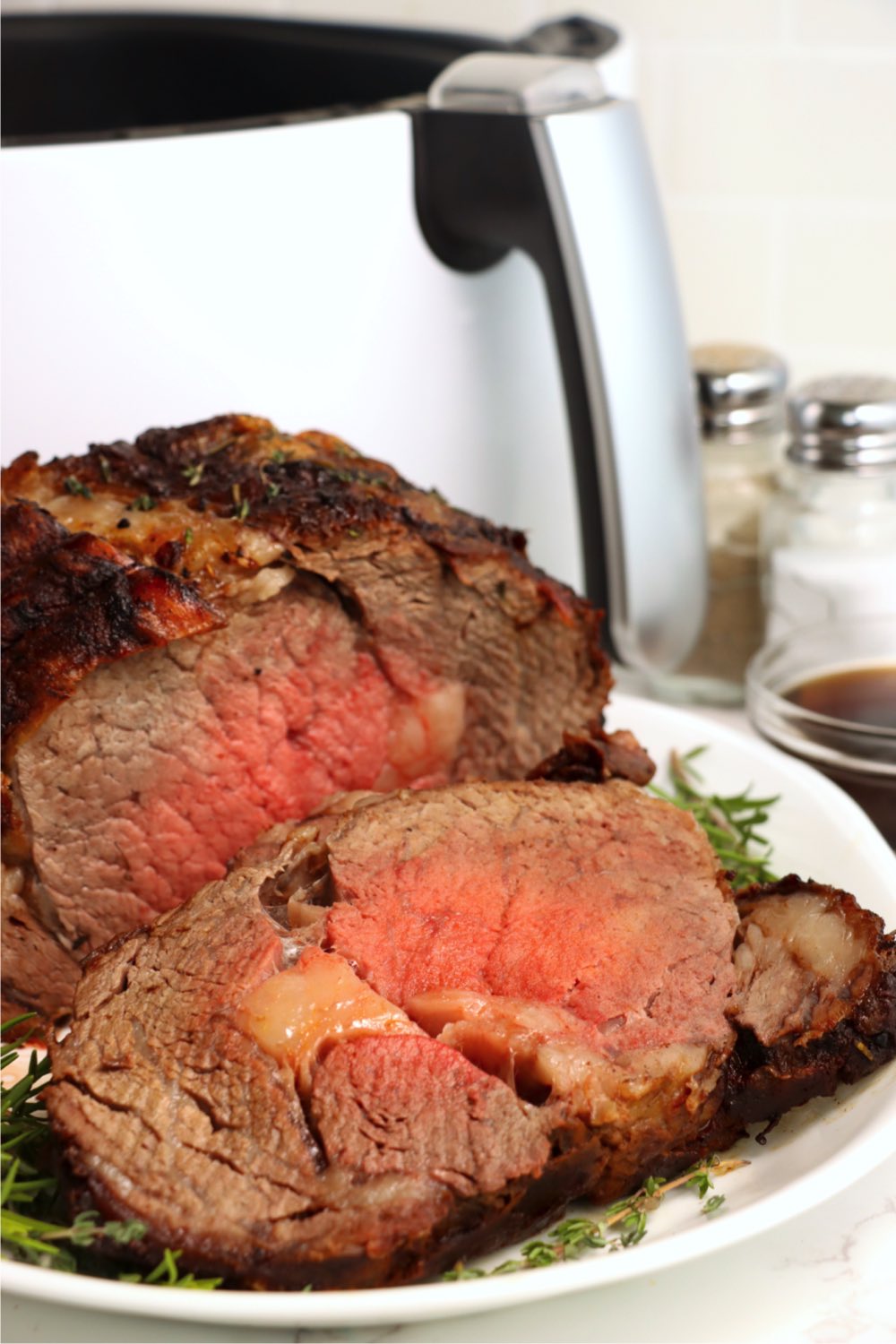 slices of prime rib in front of air fryer