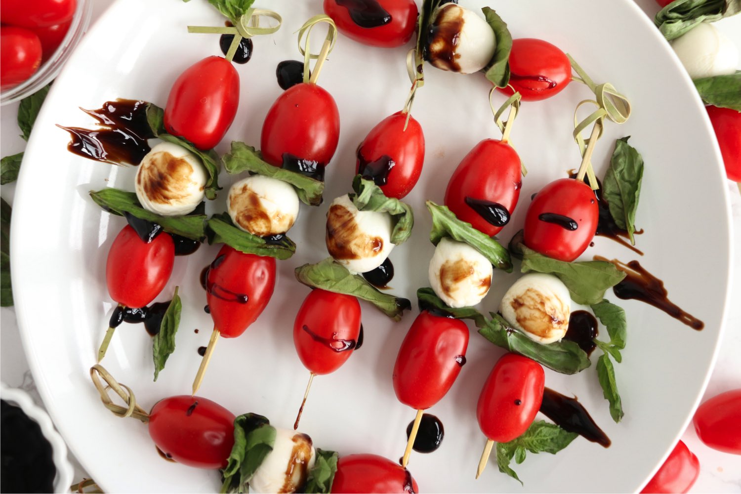 top view of caprese skewers with balsamic glaze