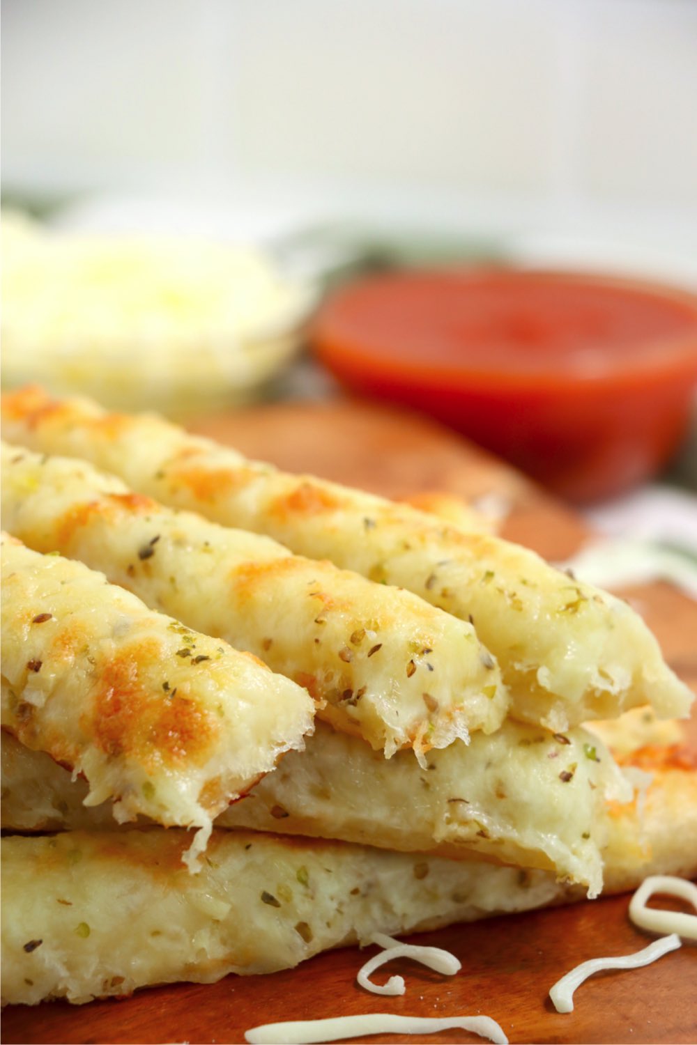 cheesy breadsticks stacked on top of each other