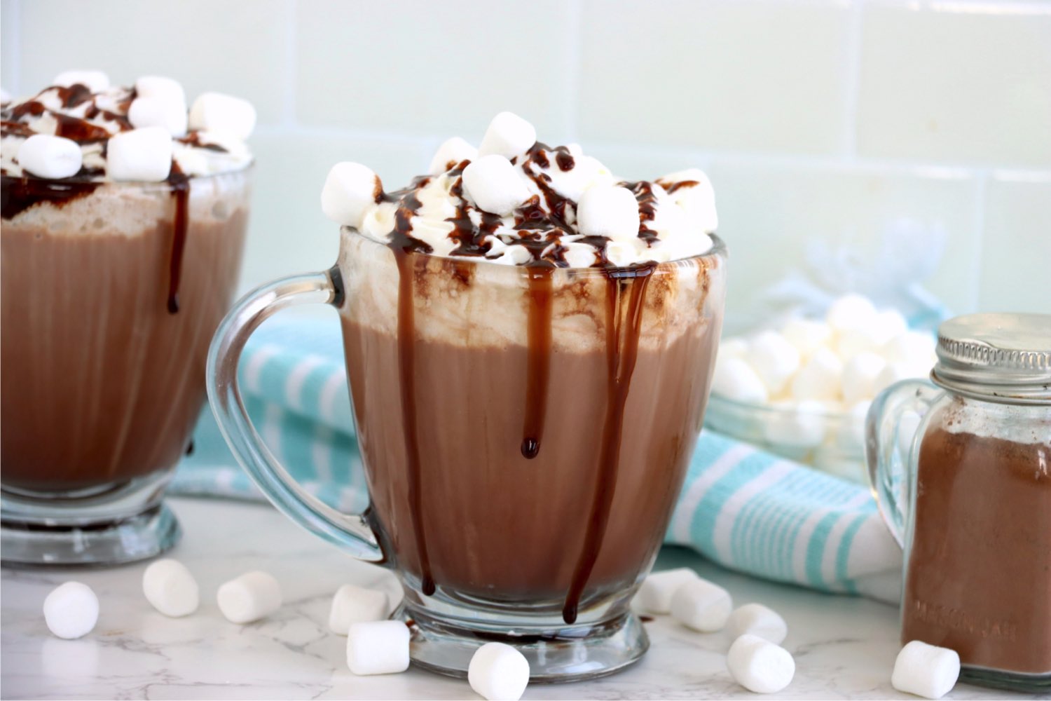 mugs of hot chocolate with toppings
