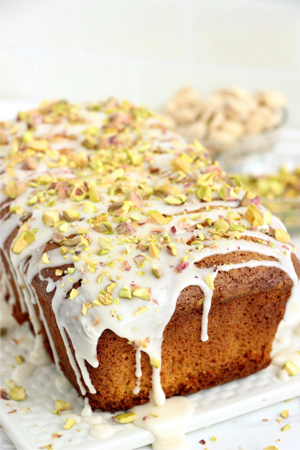 Pistachio loaf with icing drizzled on top