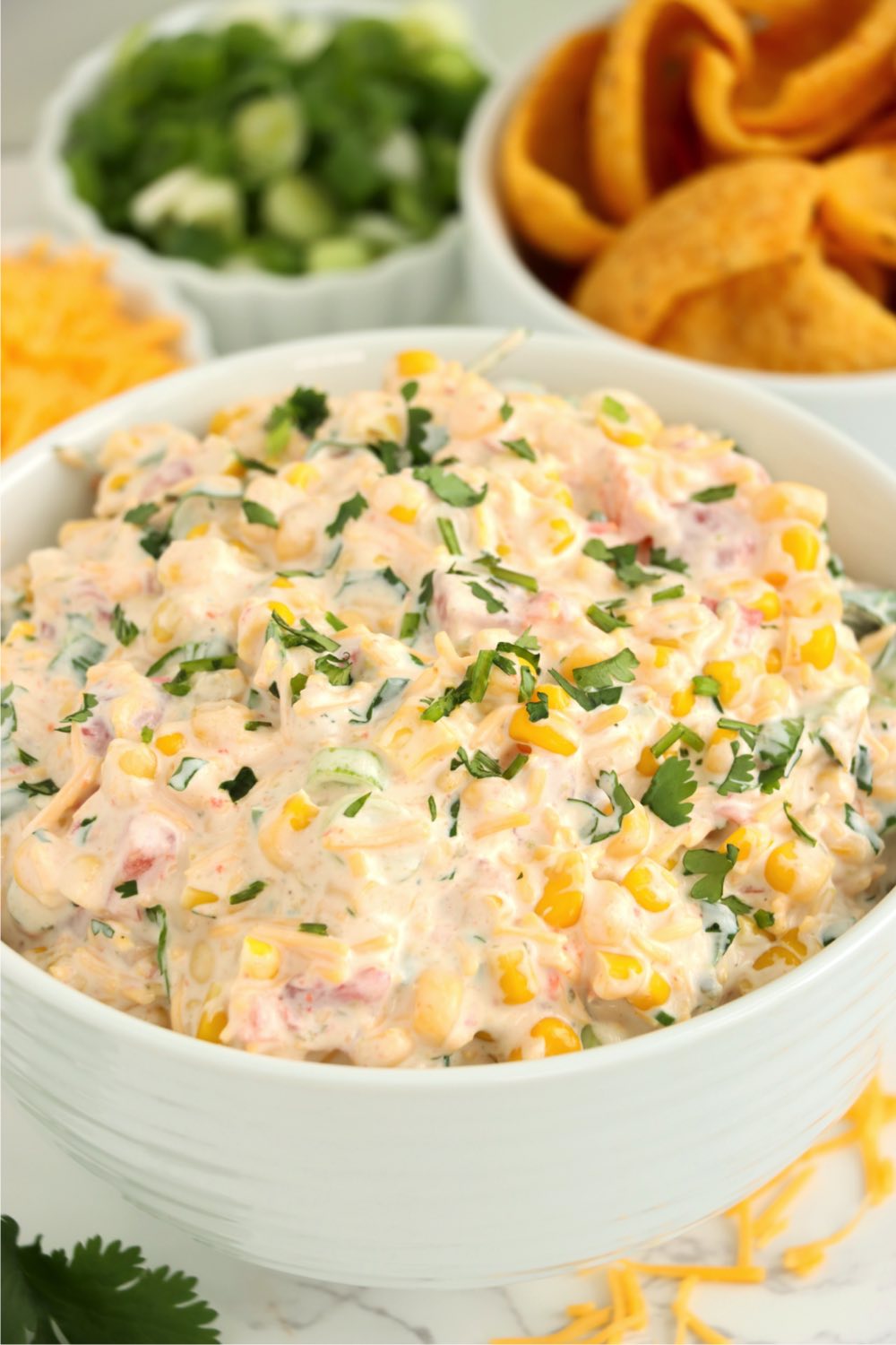 Bowl of Mexican corn dip garnished with cilantro