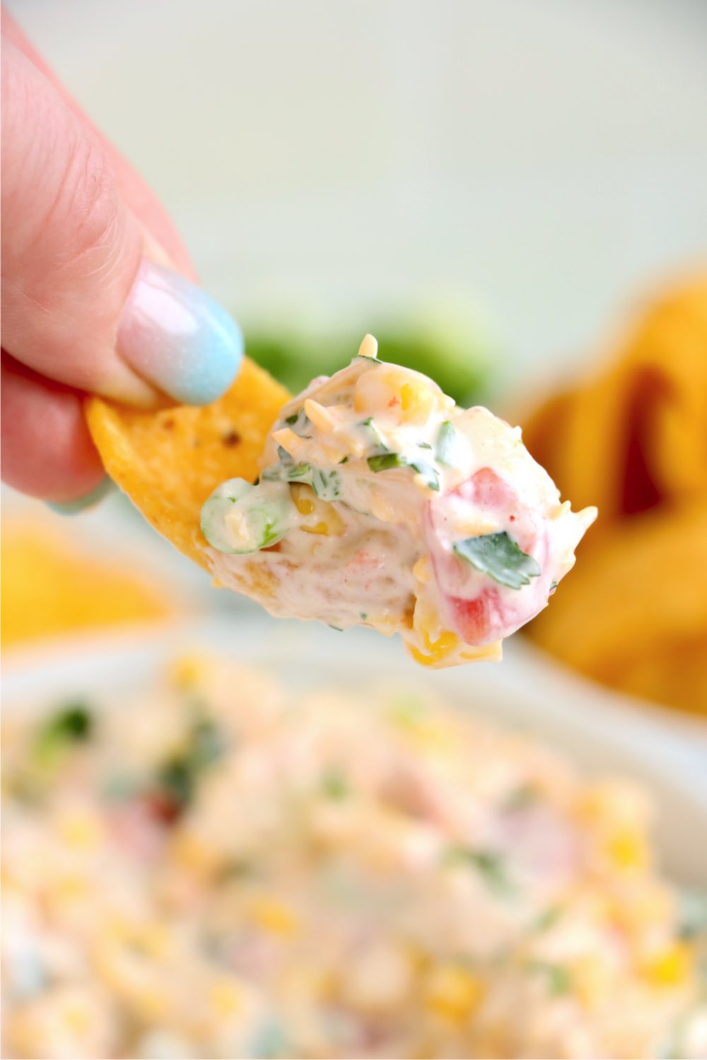 Corn chip topped with corn dip