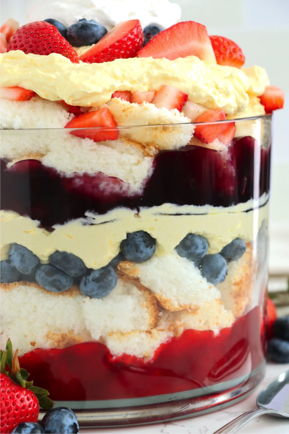 close up of layers of cake in trifle bowl