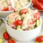 small white bowl filled with shrimp and noodles