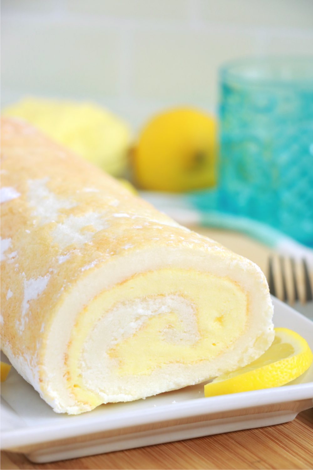 lemon cake roll sprinkled with powdered sugar