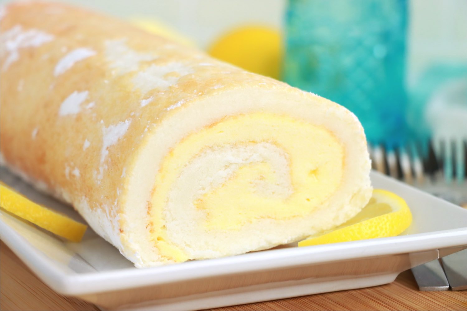 easy lemon cake roll on a white plate