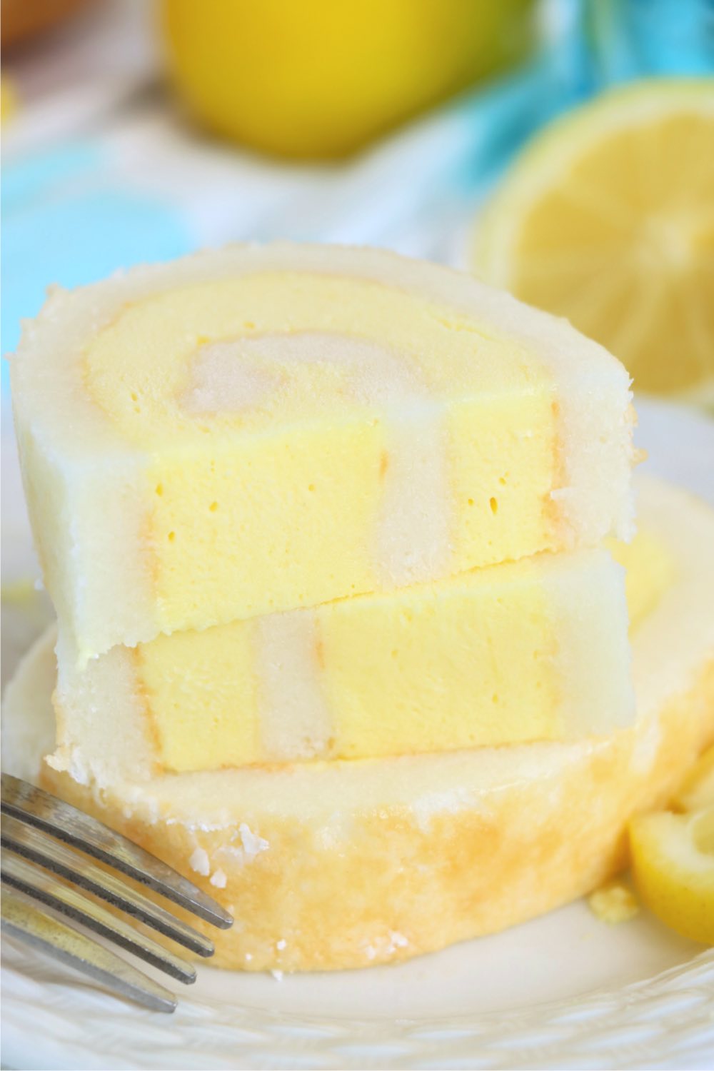 stack of cut slices of lemon cake roll