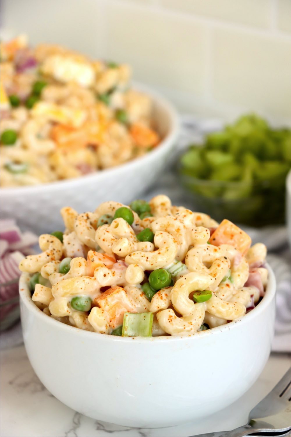small white bowl with macaroni and ham