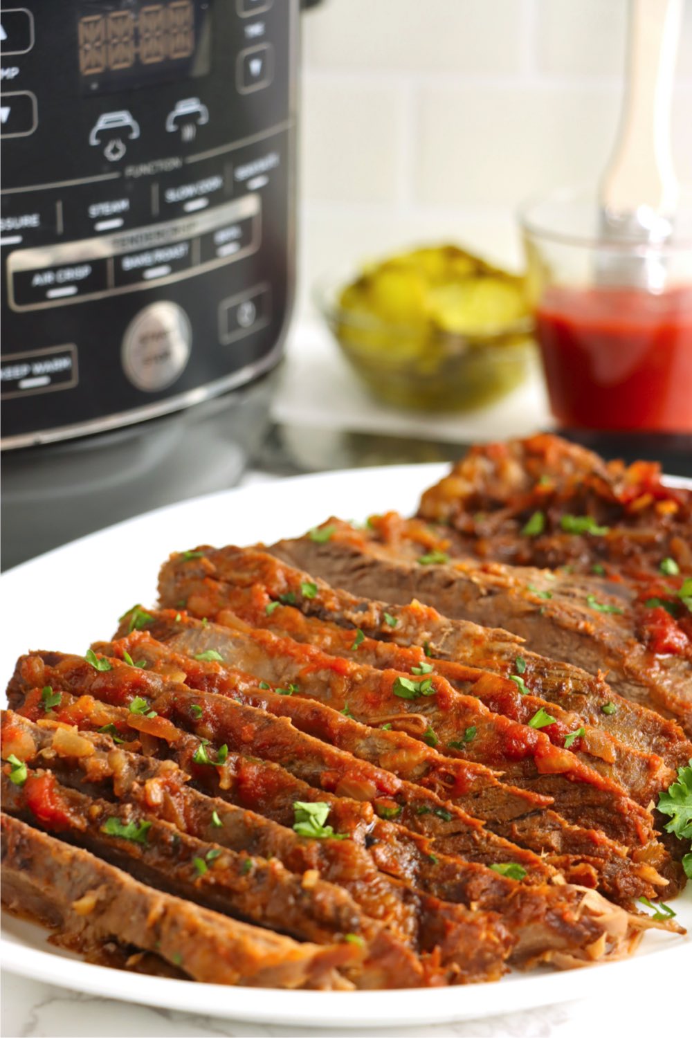 sliced beef brisket with chili sauce glazed on