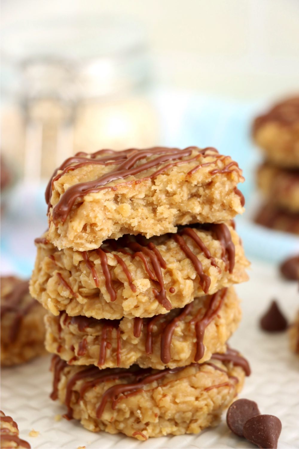 stack of peanut butter cookies with a bite out of the top one