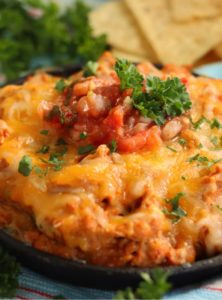 warm bean dip in a dish with cheese