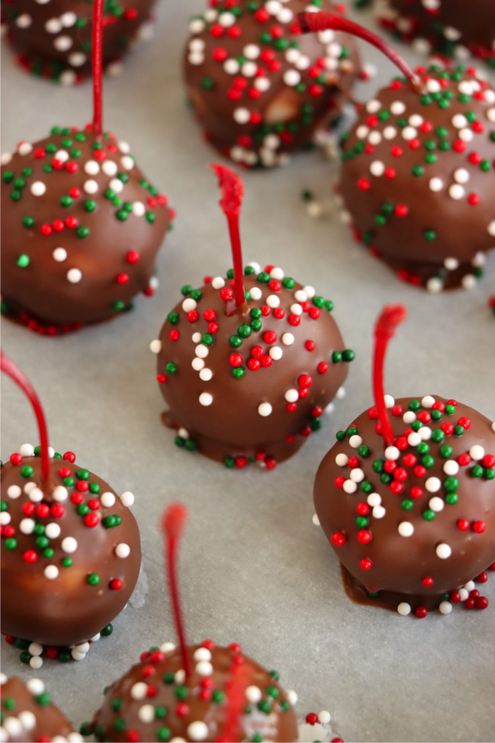 Handmade chocolate covered cherries topped with sprinkles