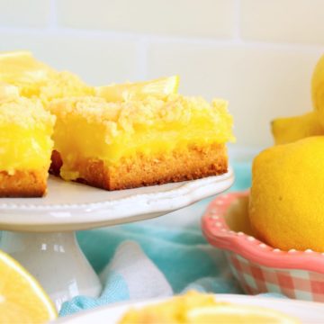 lemon bars on a dessert pedestal